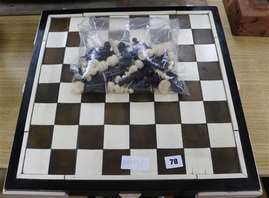 A 1930s ivory and tortoiseshell chess board and a 19th century ivory chess and draughts sets